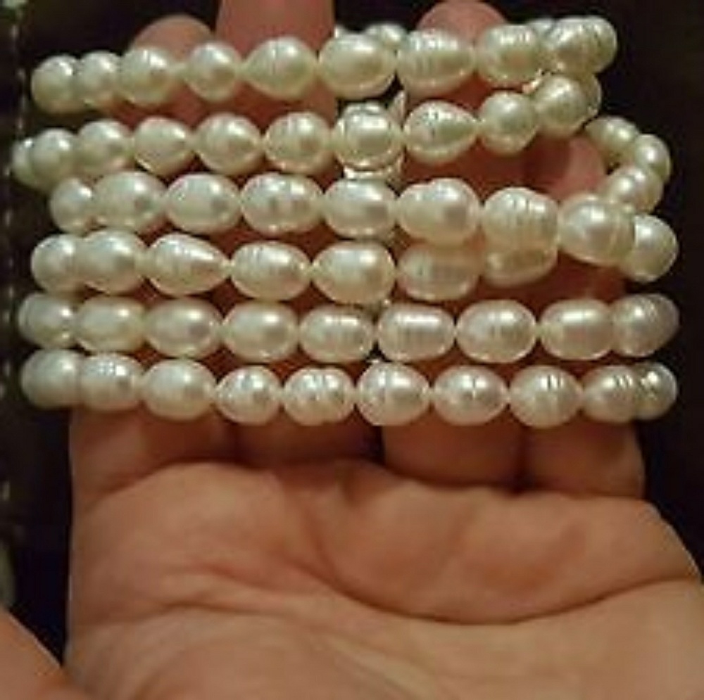 Set, three white baroque cultured pearl bracelets